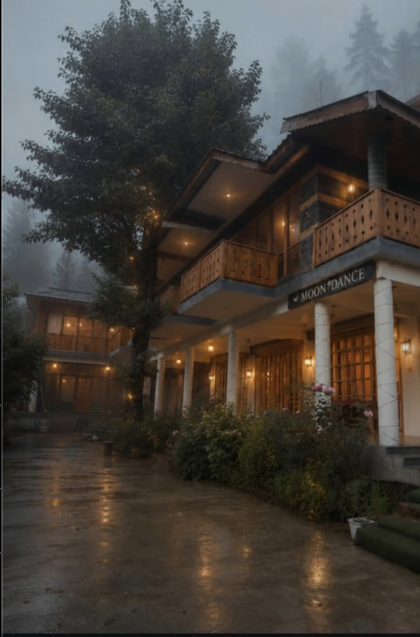 MoonDance lodge lit warmly on a wet and foggy evening
